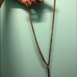 long gold knotted necklace